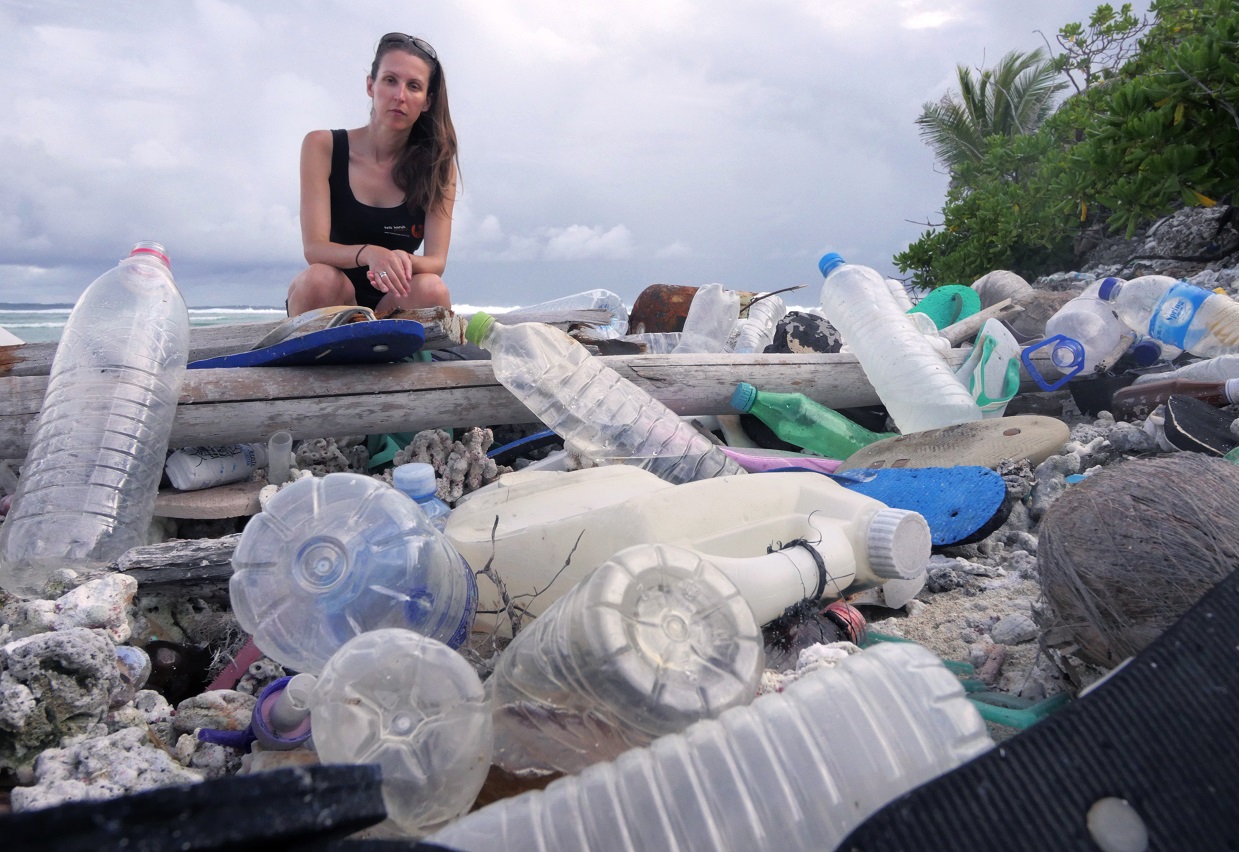 Dr Lavers with Cocos Island plastic debris